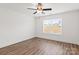 Bright bedroom featuring wood-look flooring, a ceiling fan, and a window with natural light at 6160 Lowder Rd, Salisbury, NC 28147