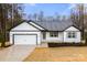 Charming single-story home with a well-maintained yard and attached garage in a quiet neighborhood at 6160 Lowder Rd, Salisbury, NC 28147
