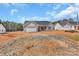Charming, single-story house with blue siding, garage, and unfinished front yard at 6160 Lowder Rd, Salisbury, NC 28147