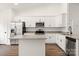 Bright kitchen featuring granite countertops, stainless steel appliances, and white cabinetry at 6160 Lowder Rd, Salisbury, NC 28147
