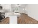Open-concept kitchen with granite counters, modern appliances, and hardwood flooring at 6160 Lowder Rd, Salisbury, NC 28147