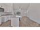 Open concept kitchen features granite countertops, white cabinets, and stainless steel dishwasher at 6160 Lowder Rd, Salisbury, NC 28147
