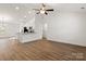 Spacious living room with hardwood floors, modern ceiling fan, and natural light from the window at 6160 Lowder Rd, Salisbury, NC 28147