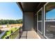 Outdoor balcony with scenic neighborhood views, dark-painted wood and black iron railings at 320 Ferebee Pl # Brx0021, Charlotte, NC 28213