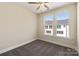 Well-lit bedroom with neutral walls, plush carpet, and a ceiling fan, offering a cozy and inviting space at 320 Ferebee Pl # Brx0021, Charlotte, NC 28213