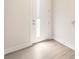 Entryway with white door with sidelight, light walls, and durable laminate flooring at 320 Ferebee Pl # Brx0021, Charlotte, NC 28213
