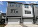 Townhome featuring a two-car garage and modern design with gray and white siding at 320 Ferebee Pl # Brx0021, Charlotte, NC 28213
