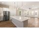 Kitchen featuring a large island, stainless steel appliances, and easy access to the living room at 320 Ferebee Pl # Brx0021, Charlotte, NC 28213