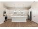 Bright, spacious kitchen with white cabinets, large island, and stainless steel appliances at 320 Ferebee Pl # Brx0021, Charlotte, NC 28213