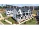 Aerial view showcasing modern townhomes with manicured lawns and inviting curb appeal at 312 Ferebee Pl # Brx0023, Charlotte, NC 28213