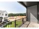 View from balcony overlooking green space and new construction of modern home at 312 Ferebee Pl # Brx0023, Charlotte, NC 28213