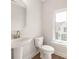 Bathroom with a white sink and a toilet beside a window at 312 Ferebee Pl # Brx0023, Charlotte, NC 28213