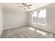 Bedroom with two windows with gray carpet and white walls at 312 Ferebee Pl # Brx0023, Charlotte, NC 28213