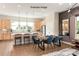 Open concept dining room features wood floors, stylish lighting, and a dining set for an inviting atmosphere at 312 Ferebee Pl # Brx0023, Charlotte, NC 28213