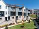 Modern townhome featuring a private balcony and well-maintained landscaping at 312 Ferebee Pl # Brx0023, Charlotte, NC 28213