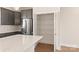 Well-organized kitchen with white countertops, stainless steel appliances and a pantry at 312 Ferebee Pl # Brx0023, Charlotte, NC 28213