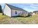 Back view of house showing the backyard with small deck on a sunny day at 6133 Long Branch Rd, Salisbury, NC 28147