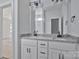 Bathroom featuring a double sink vanity with granite countertop and dark fixtures at 6133 Long Branch Rd, Salisbury, NC 28147