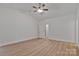 Bright bedroom with vaulted ceiling, fan, light hardwood floors, white walls and doors at 6133 Long Branch Rd, Salisbury, NC 28147