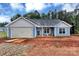 Charming blue single-story home with attached garage and craftsman-style details at 6133 Long Branch Rd, Salisbury, NC 28147