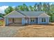 Charming single-story home featuring light blue siding and an attached, open single-car garage at 6133 Long Branch Rd, Salisbury, NC 28147