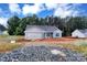 New construction home with blue vinyl siding, gray roof, and a two-car garage on a sunny day at 6133 Long Branch Rd, Salisbury, NC 28147