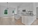 Contemporary kitchen featuring white cabinets, granite countertops, and stainless steel appliances at 6133 Long Branch Rd, Salisbury, NC 28147