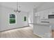 Modern kitchen with white cabinetry, granite countertops, and stainless steel appliances at 6133 Long Branch Rd, Salisbury, NC 28147