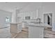An unfinished modern kitchen with granite countertops, a kitchen island and white cabinetry at 6133 Long Branch Rd, Salisbury, NC 28147