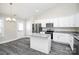 Bright, modern kitchen with white cabinets, an island, granite counters, and stainless steel appliances at 6133 Long Branch Rd, Salisbury, NC 28147