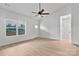 Bright living room with natural light, hardwood floors, and a modern ceiling fan at 6133 Long Branch Rd, Salisbury, NC 28147