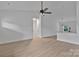 Spacious living area with a modern ceiling fan, seamlessly connected to the kitchen at 6133 Long Branch Rd, Salisbury, NC 28147