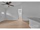 Open floor plan living area with light wood-look flooring and granite countertops at 6133 Long Branch Rd, Salisbury, NC 28147