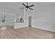 Open concept living room featuring modern ceiling fan, and beautiful wood-look flooring at 6133 Long Branch Rd, Salisbury, NC 28147