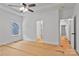 Bright bedroom featuring a ceiling fan, multiple windows and an open doorway at 6147 Long Branch Rd, Salisbury, NC 28147