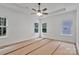 Spacious bedroom with a ceiling fan and multiple windows providing natural light at 6147 Long Branch Rd, Salisbury, NC 28147