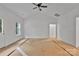 Well-lit bedroom featuring white walls and ceiling fan at 6147 Long Branch Rd, Salisbury, NC 28147