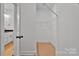 Walk-in closet with shelving and a view into a bathroom and vanity at 6147 Long Branch Rd, Salisbury, NC 28147