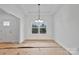 Bright dining area featuring white walls, large window, and modern lighting at 6147 Long Branch Rd, Salisbury, NC 28147