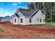 Charming single Gathering house with light colored siding and a dark roof and shutters at 6147 Long Branch Rd, Salisbury, NC 28147