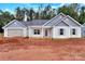 Charming single-story home with blue and white siding, gray shutters, and an attached garage at 6147 Long Branch Rd, Salisbury, NC 28147