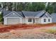 Exterior of a single Gathering home with light siding and a dark gray roof with a two-car garage at 6147 Long Branch Rd, Salisbury, NC 28147