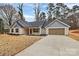 Home exterior with a long driveway and 2-car garage in a desirable neighborhood at 6147 Long Branch Rd, Salisbury, NC 28147