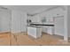Stylish kitchen with white cabinets, island, and modern appliances at 6147 Long Branch Rd, Salisbury, NC 28147