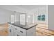 Kitchen island featuring granite countertops and modern fixtures at 6147 Long Branch Rd, Salisbury, NC 28147
