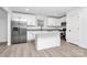 Modern kitchen featuring white cabinets, stainless steel appliances, and an island with granite countertops at 6147 Long Branch Rd, Salisbury, NC 28147