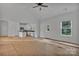 Bright and airy living room with white walls, kitchen island and access to backyard at 6147 Long Branch Rd, Salisbury, NC 28147