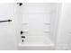 All-white shower and tub with matte black fixtures, including shower head and faucet at 6147 Long Branch Rd, Salisbury, NC 28147