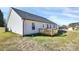 View of the home's backyard with a wooden deck and vinyl siding at 6155 Long Branch Rd, Salisbury, NC 28147