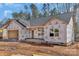 New construction home featuring an attached garage, and windows on a building site at 6155 Long Branch Rd, Salisbury, NC 28147